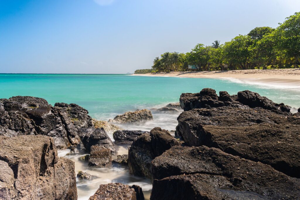 Tropical beach at Fantasy Island Honduras near clear water and coral reef diving